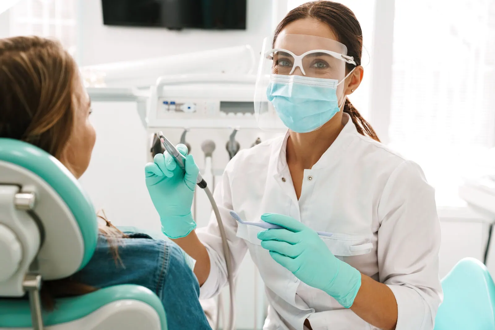 Dental team reviewing a treatment plan with a patient